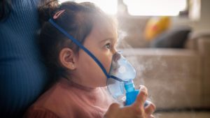 The woman and her daughter use an inhaler.